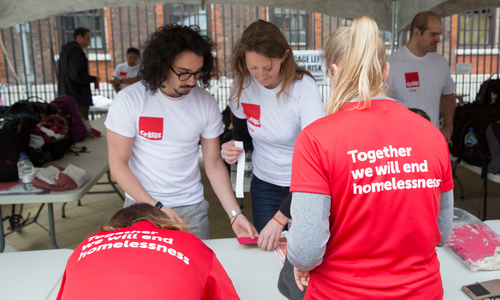 Volunteers run the registration and baggage tents at Paternoster Square during the annual square mile run